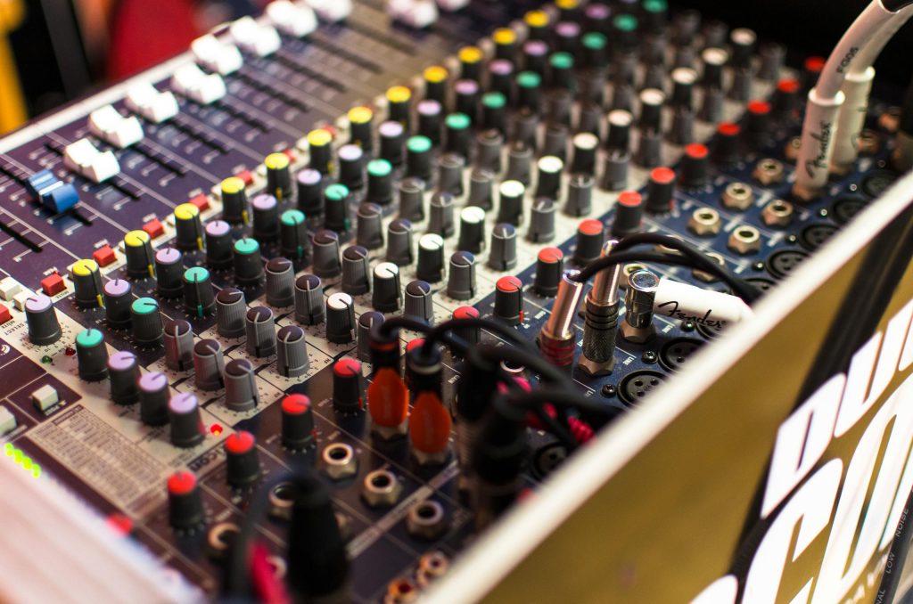 Close up of an audio mixer, signifying that crew are also welcome at Musician Therapy Collective