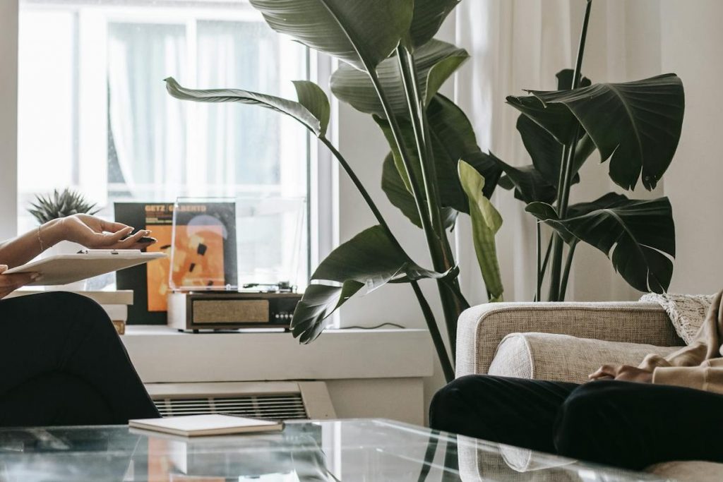 Side view of professional female therapist modeling therapy with musician therapy collective.