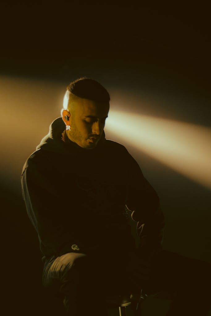 A moody silhouette portrait of a man with depression who may benefit from Musician Therapy Collective's services