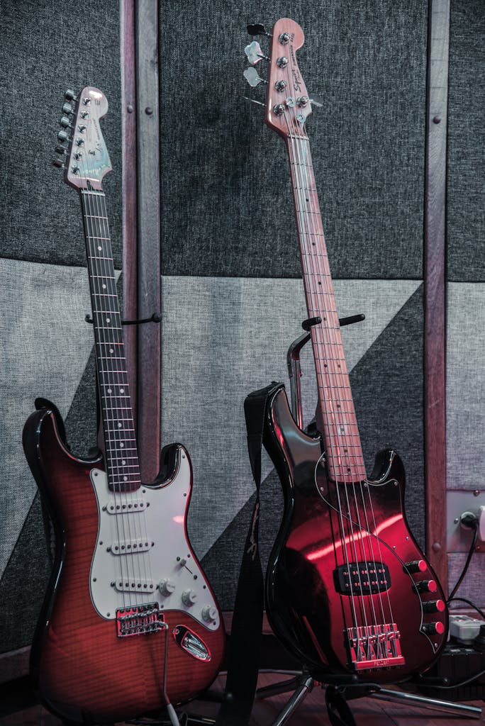 Two electric and bass guitars in a soundproof music studio setting. Perfect for music themes.
